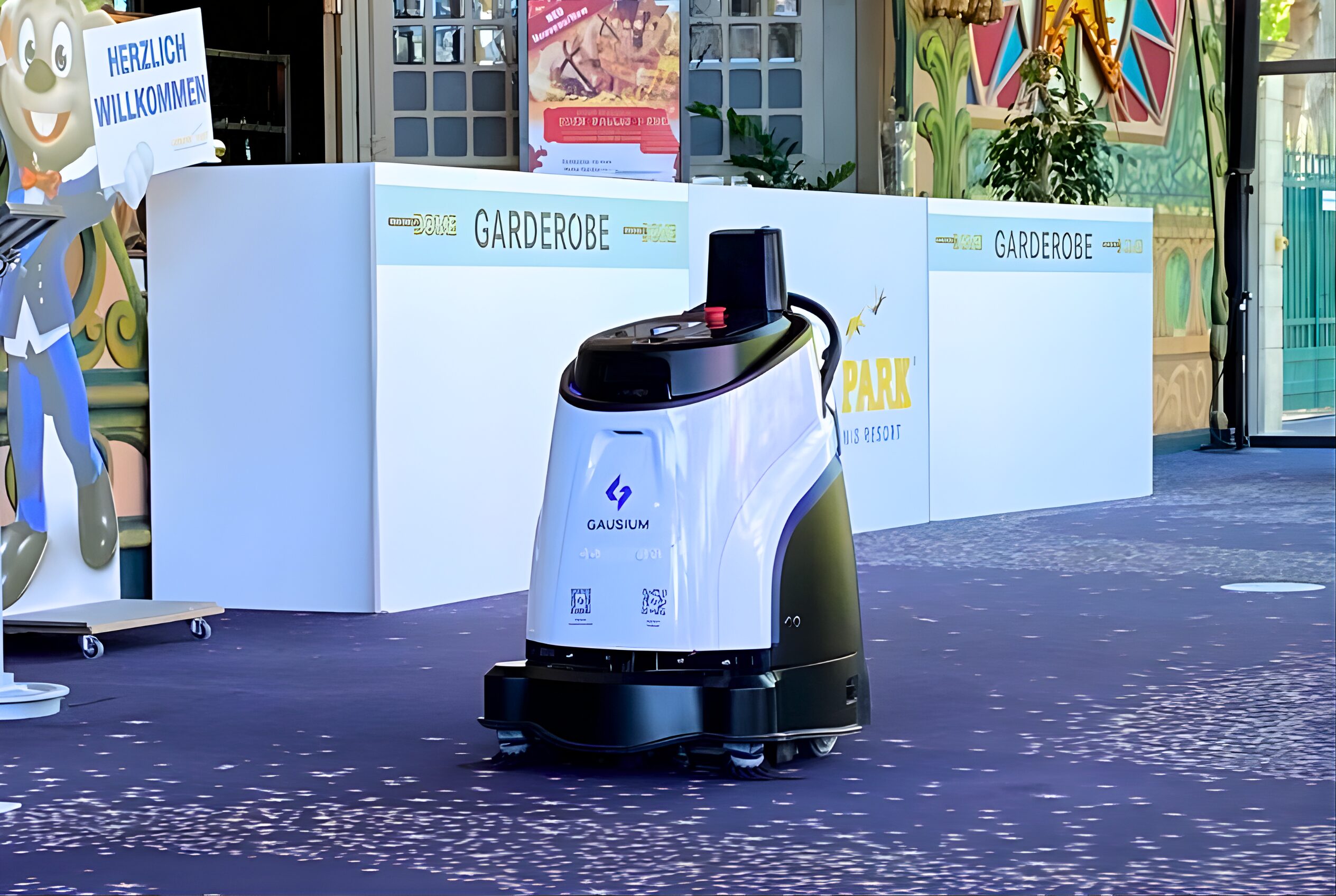 The Gausium Vacuum 40 commercial robotic vacuum rolling through a retail setting.